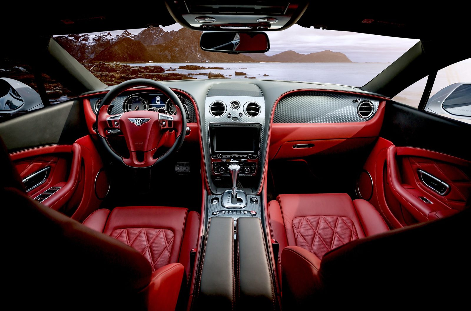 Bentley interior with red leather and a Pacific Northwest mountain view