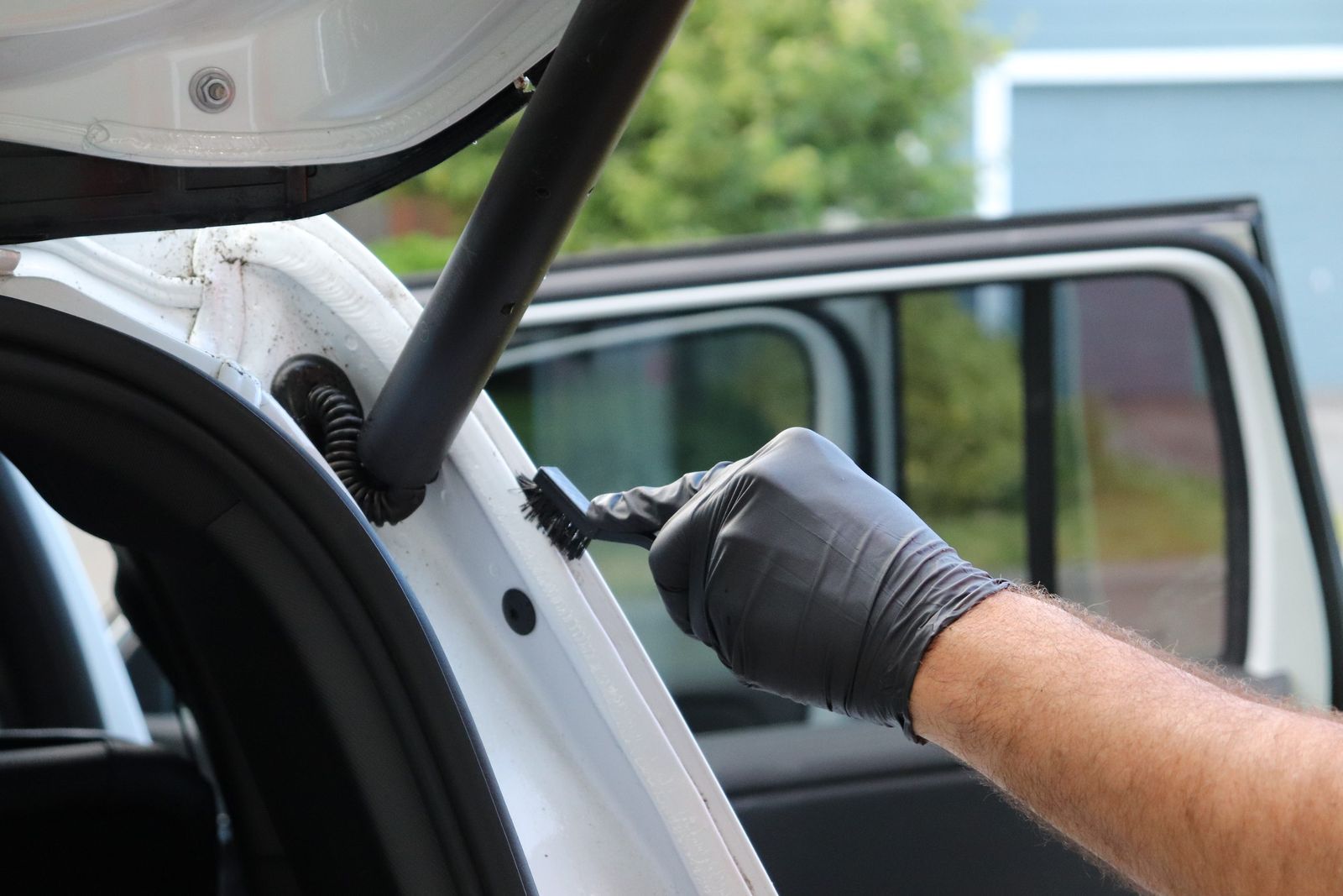 Brushing out the door jamb during a full detail