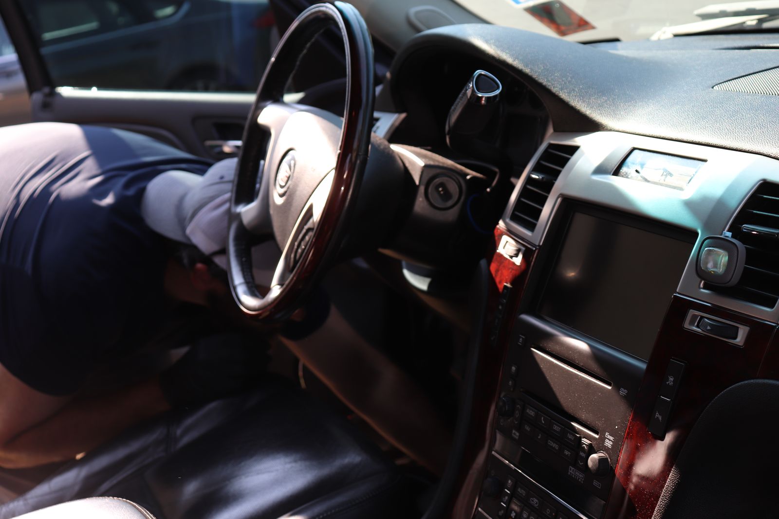 Cleaned Cadillac Escalade dashboard, steering wheel and center console after an interior detail