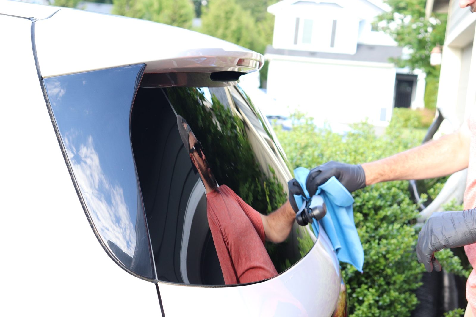 Wiping down the rear glass after a wash